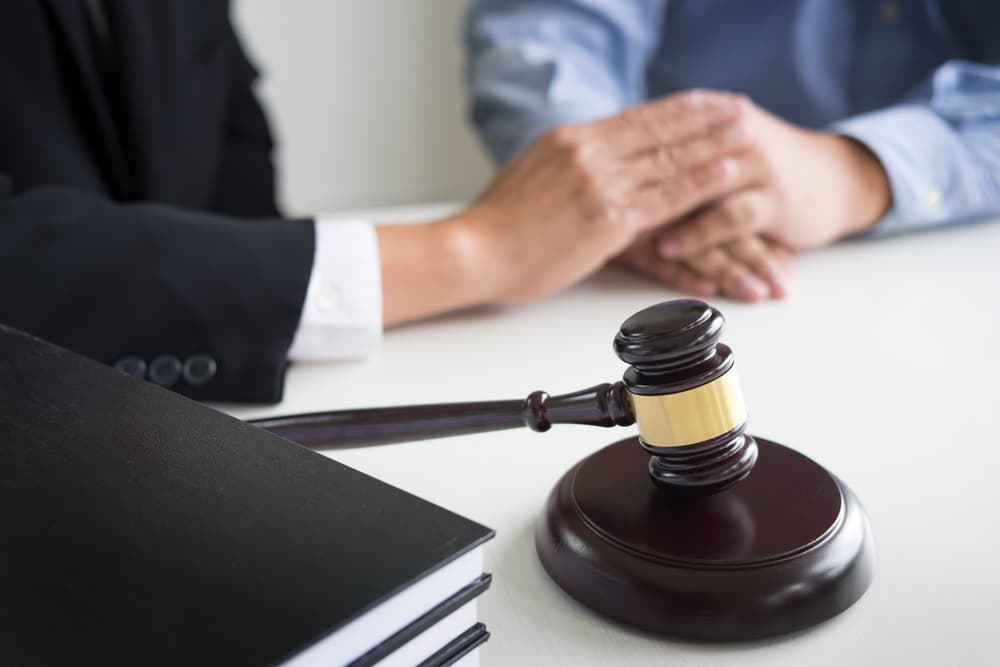 Lawyer talking to client about Restraining order Hearing
